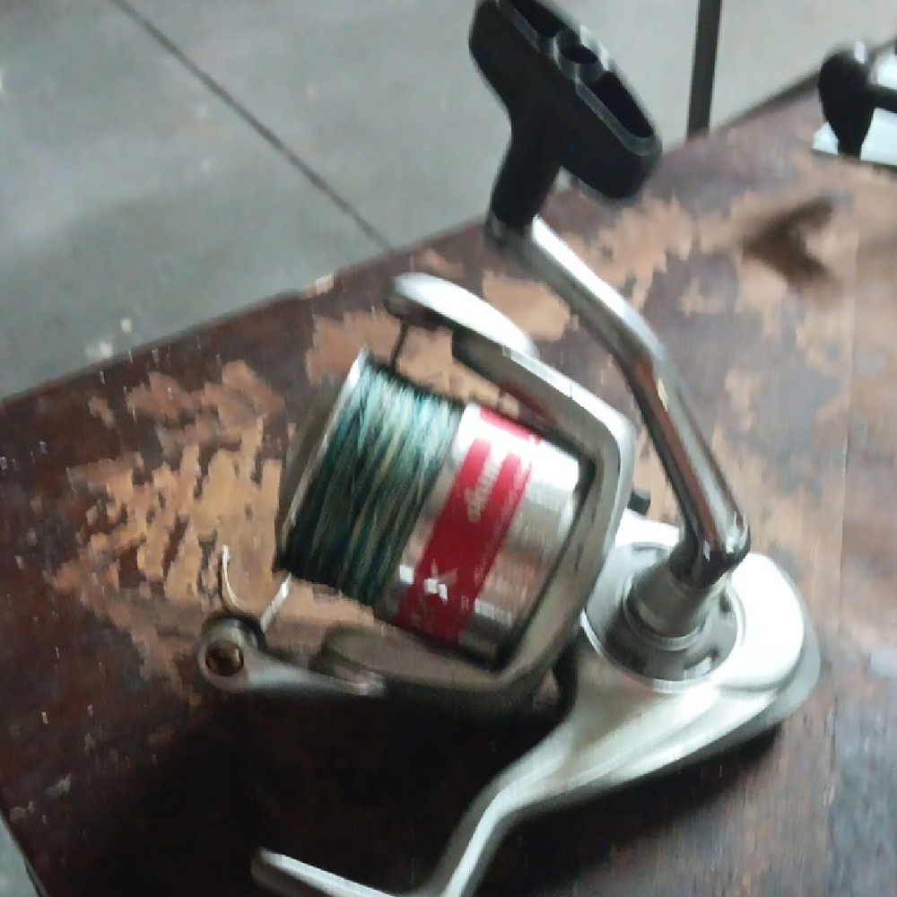 Okuma Nitryx Silver Fishing Reel with Red and Green Accents (Sku 502)